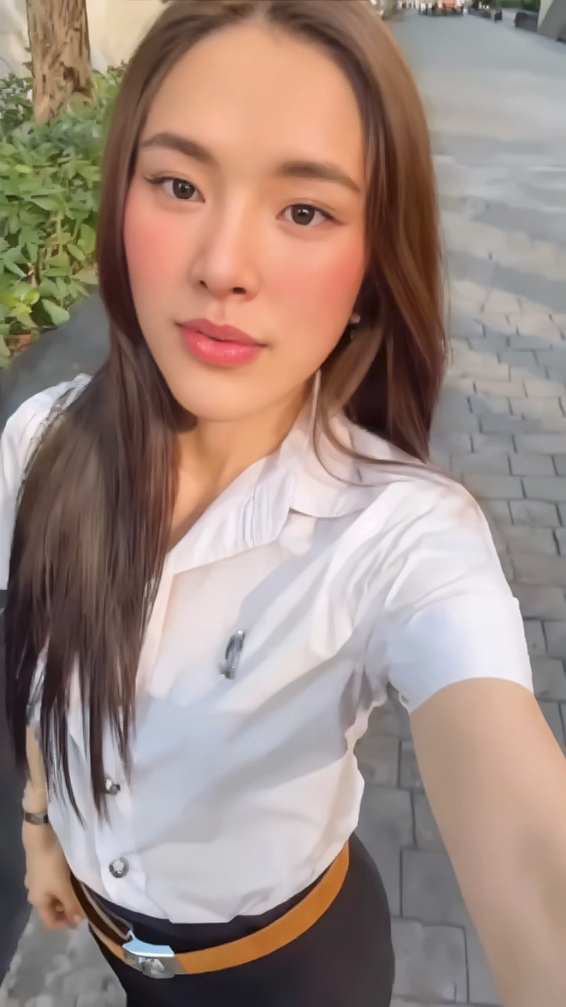 Punpun Sutatta in a Thai university outfit, exuding style and grace.